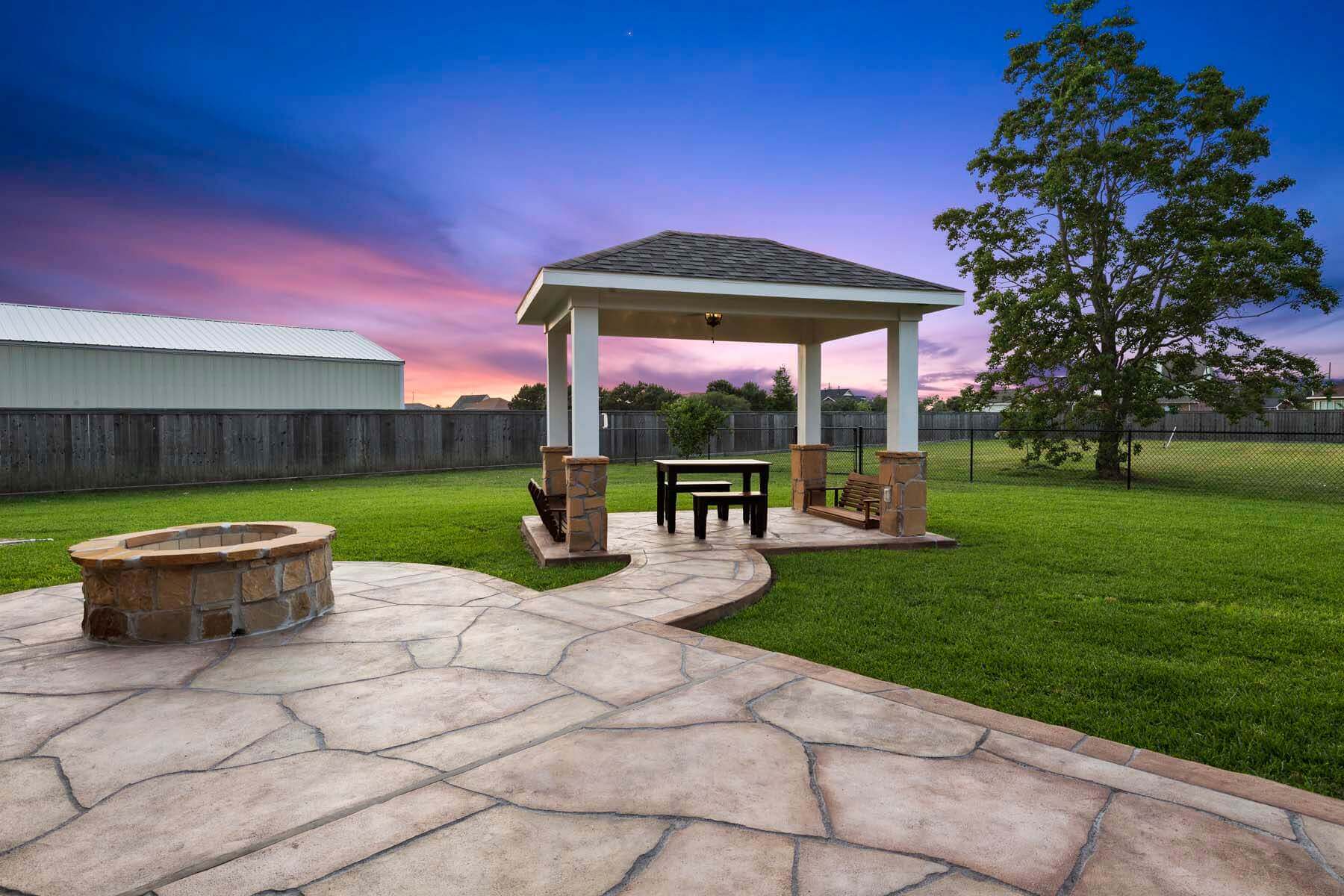 Carvestone patio pergola backyard views Austin Texas hardscape