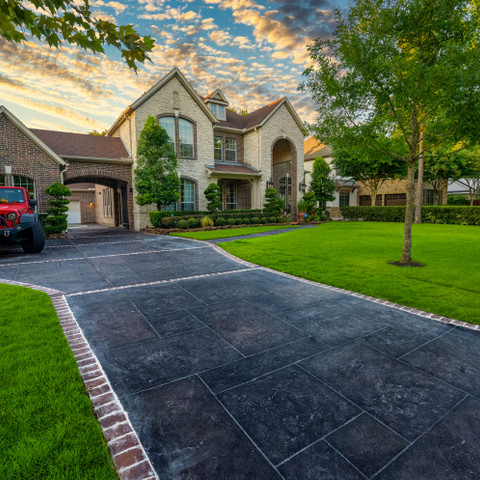 Updated driveway with decorative carvestone concrete overlay Houston Texas