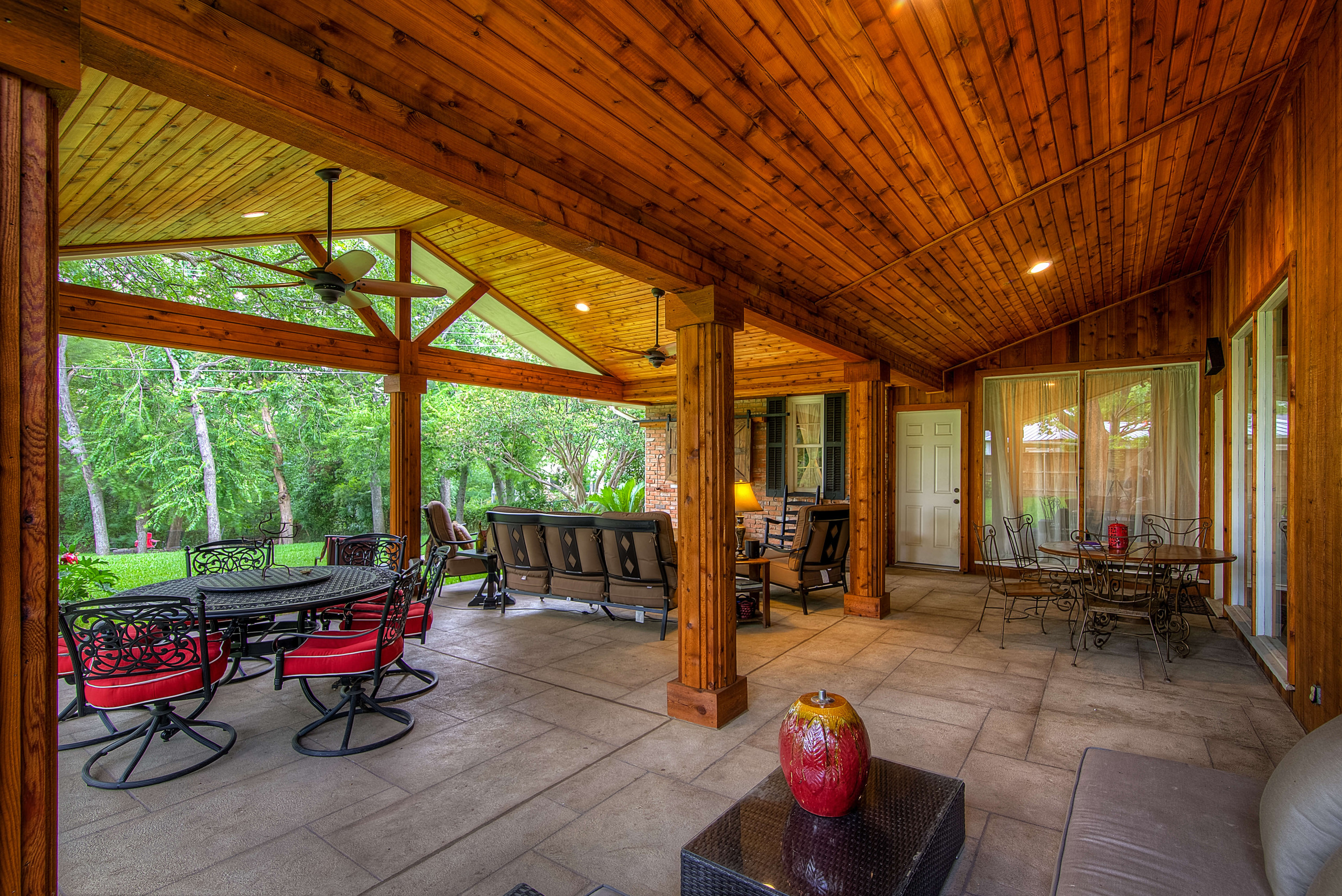 Custom Carvestone concrete overlay hardscape Texas backyard patio cover