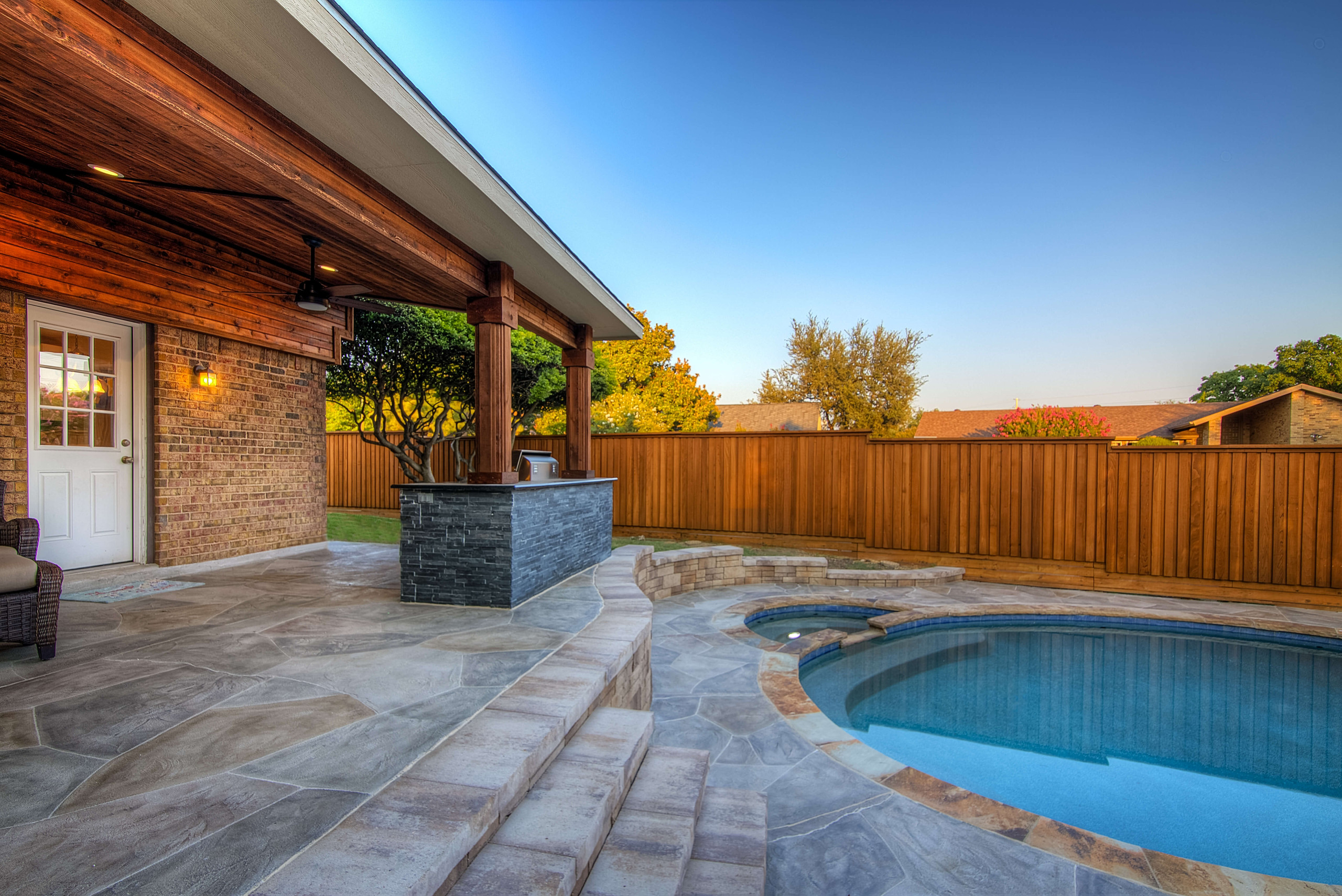 Backyard renovation Carvestone concrete design style hardscape idea