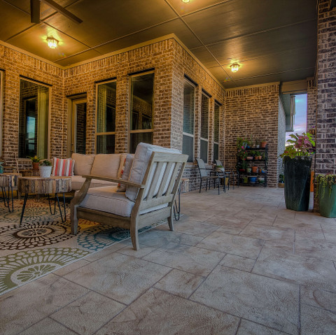 Backyard patio with Carvestone decorative concrete overlay design idea