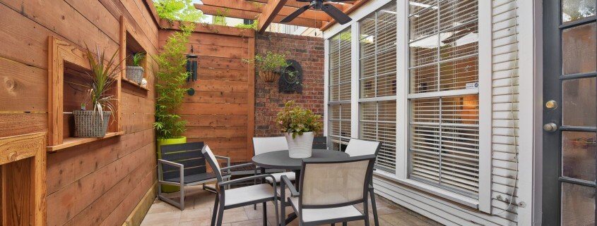 Small custom patio privacy wall and wooden pergola design