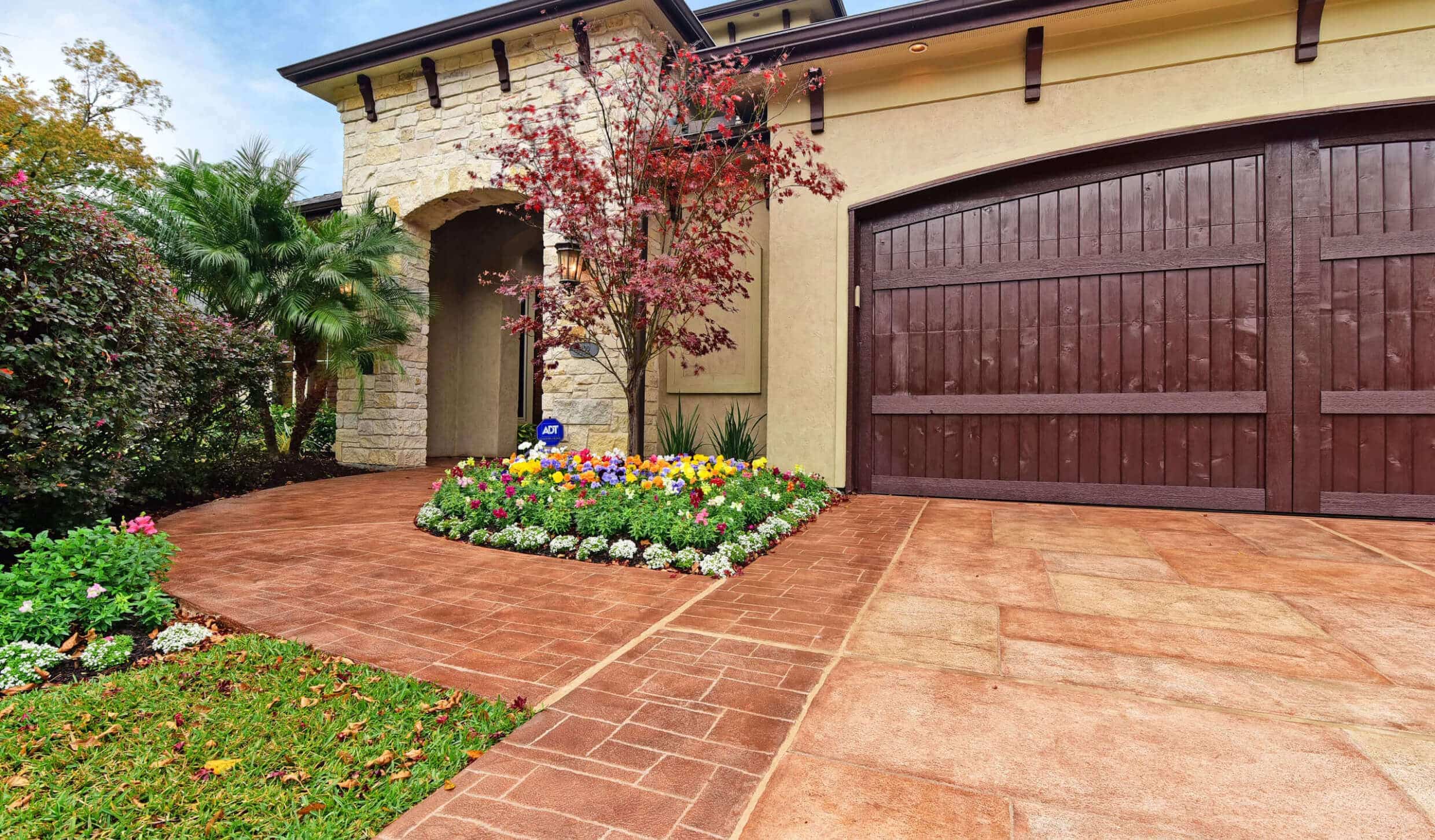 Beautiful custom Carvestone driveway and sidewalk