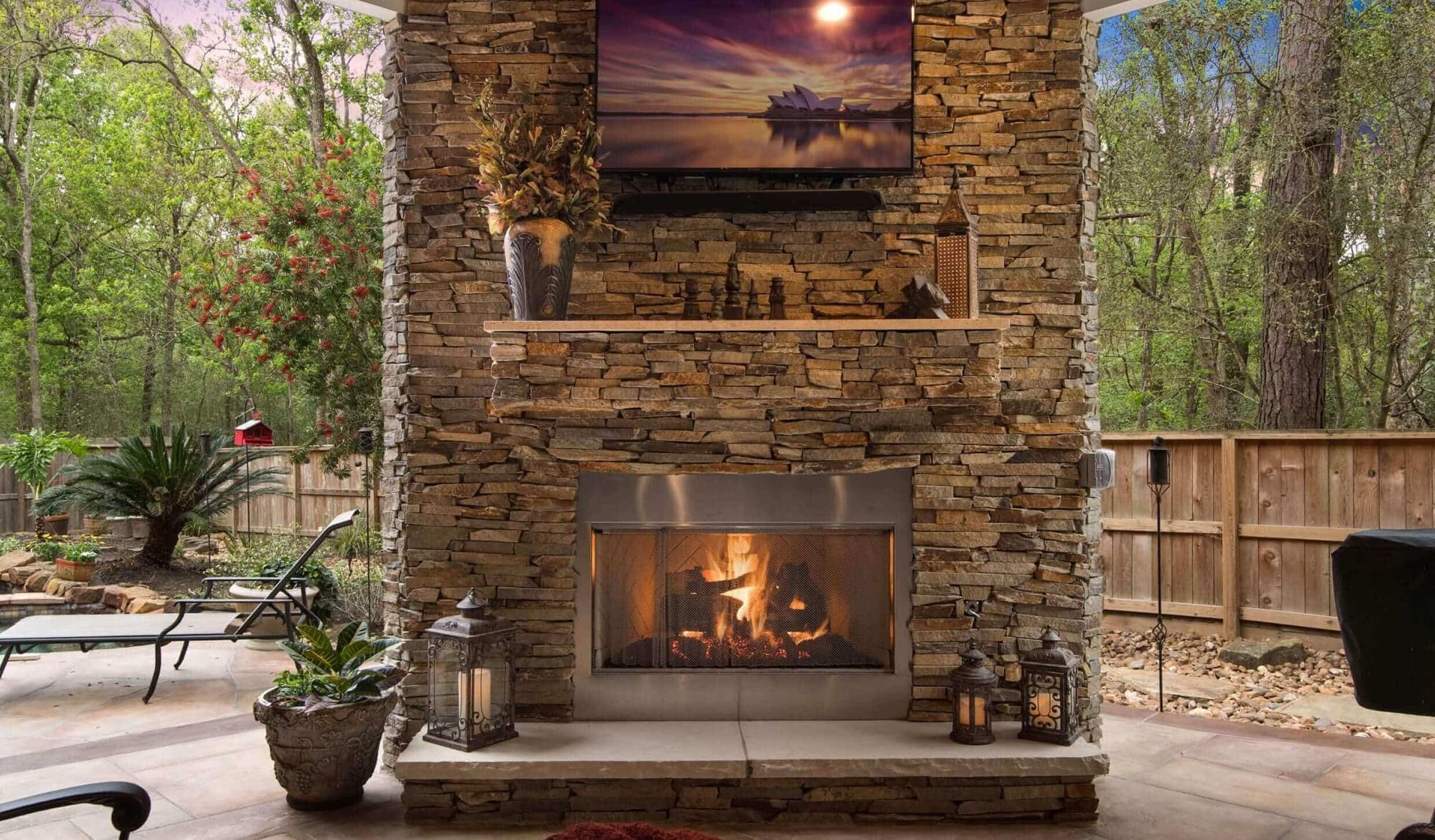 Stone fireplace for a cozy and inviting covered patio