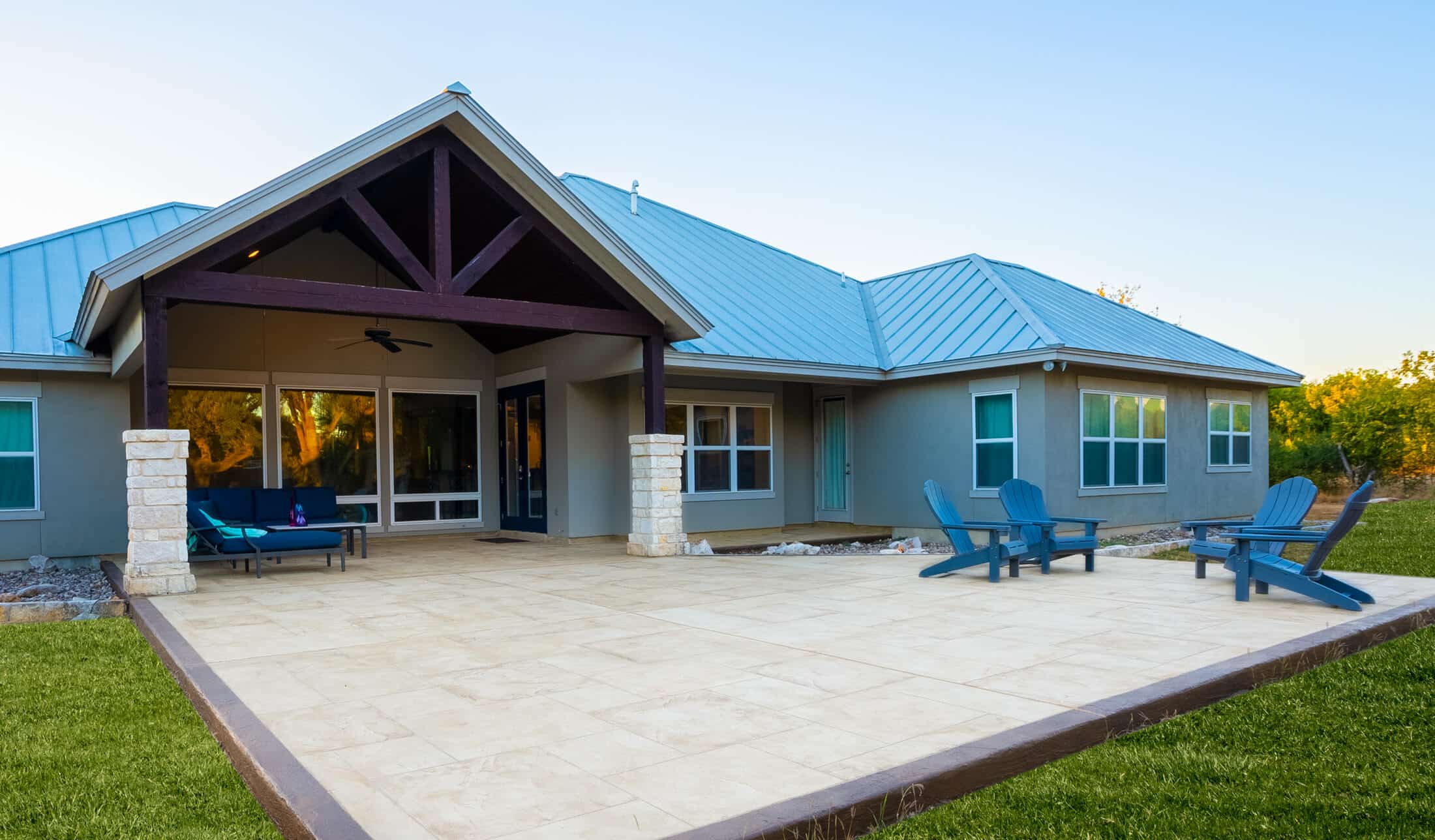 Gabled patio cover with stone-wrapped posts