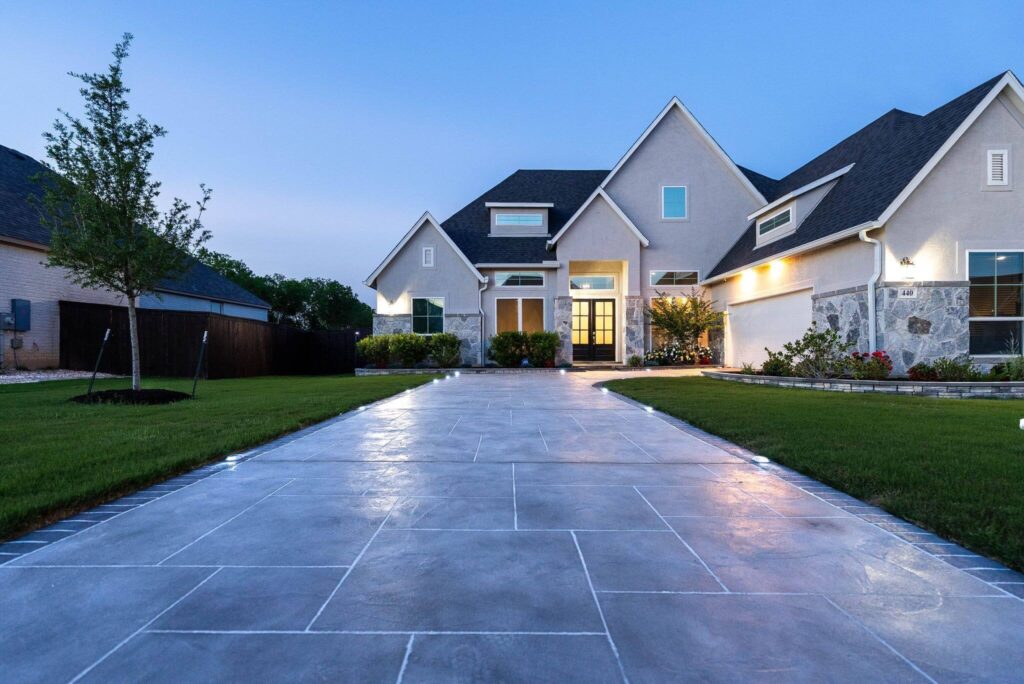 Wide driveway and walkway leading to a home