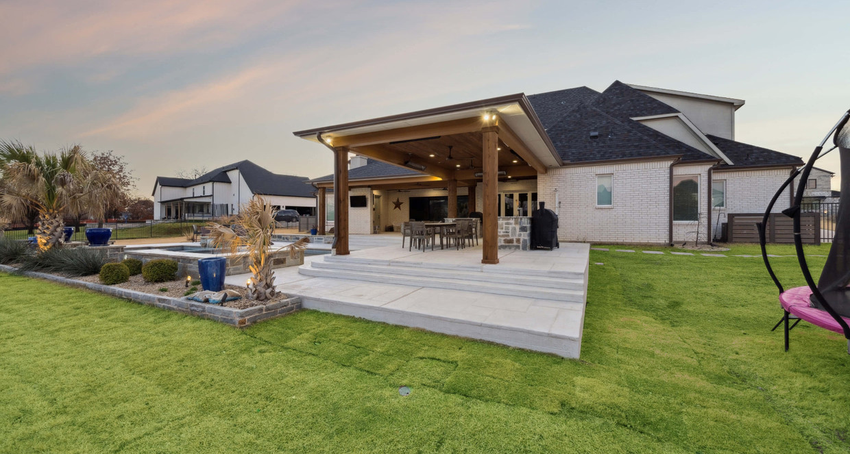 After view of pool patio with covered outdoor kitchen