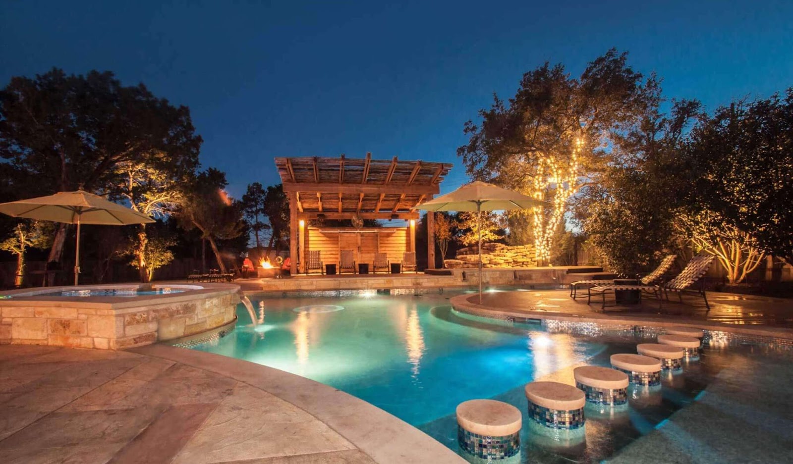 luxury pool remodeling in texas with pergola spa and water feature