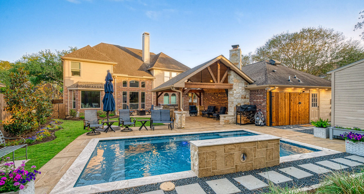 texas backyard idea with inground pool, gable covered patio and seating area