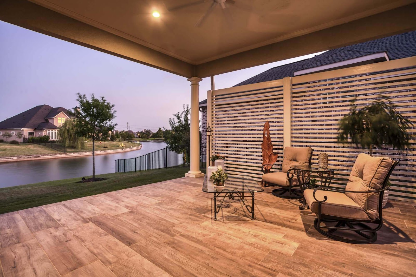 front yard covered patio with privacy fence and carvestone modified concrete overlay flooring