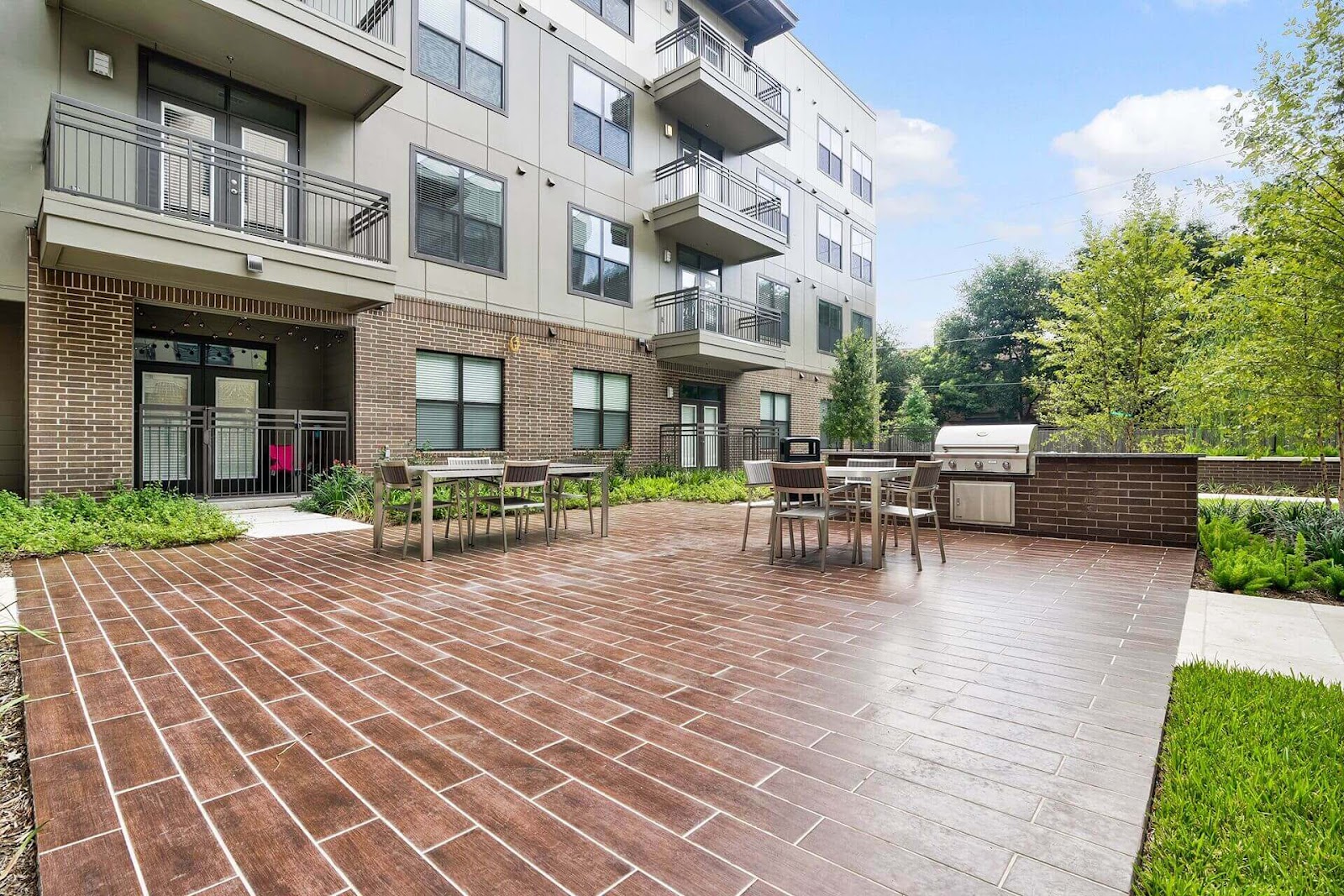 urban red outdoor tile patio with subway tile design and outdoor grill station