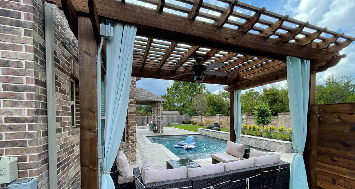 beach inspired lattice wood pergola with roof and coastal fabric accents