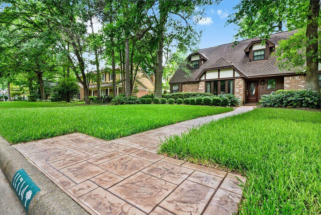 stamped concrete walkway rustic texas ranch
