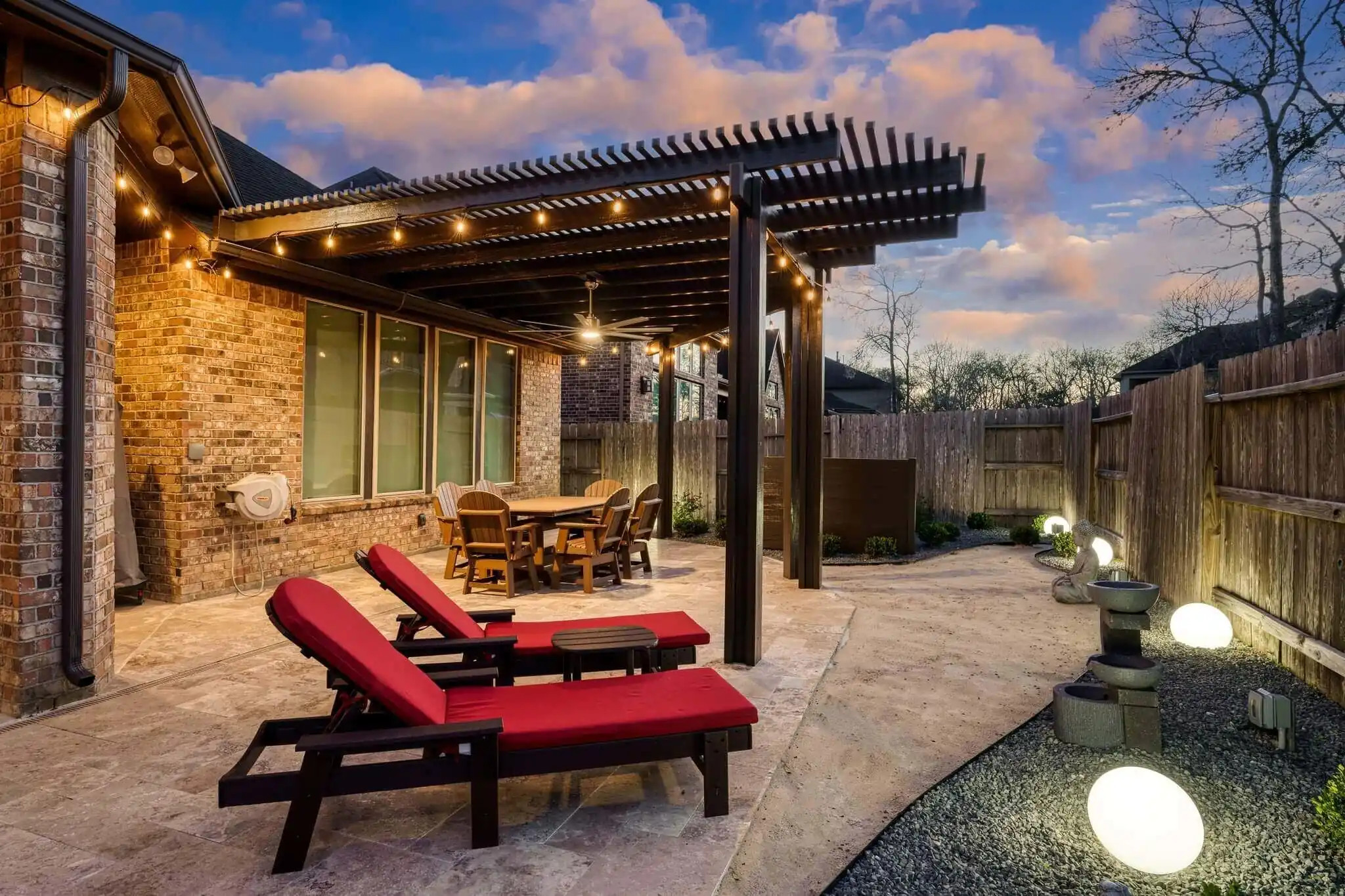 attached aluminum pergola in backyard dining area in texas