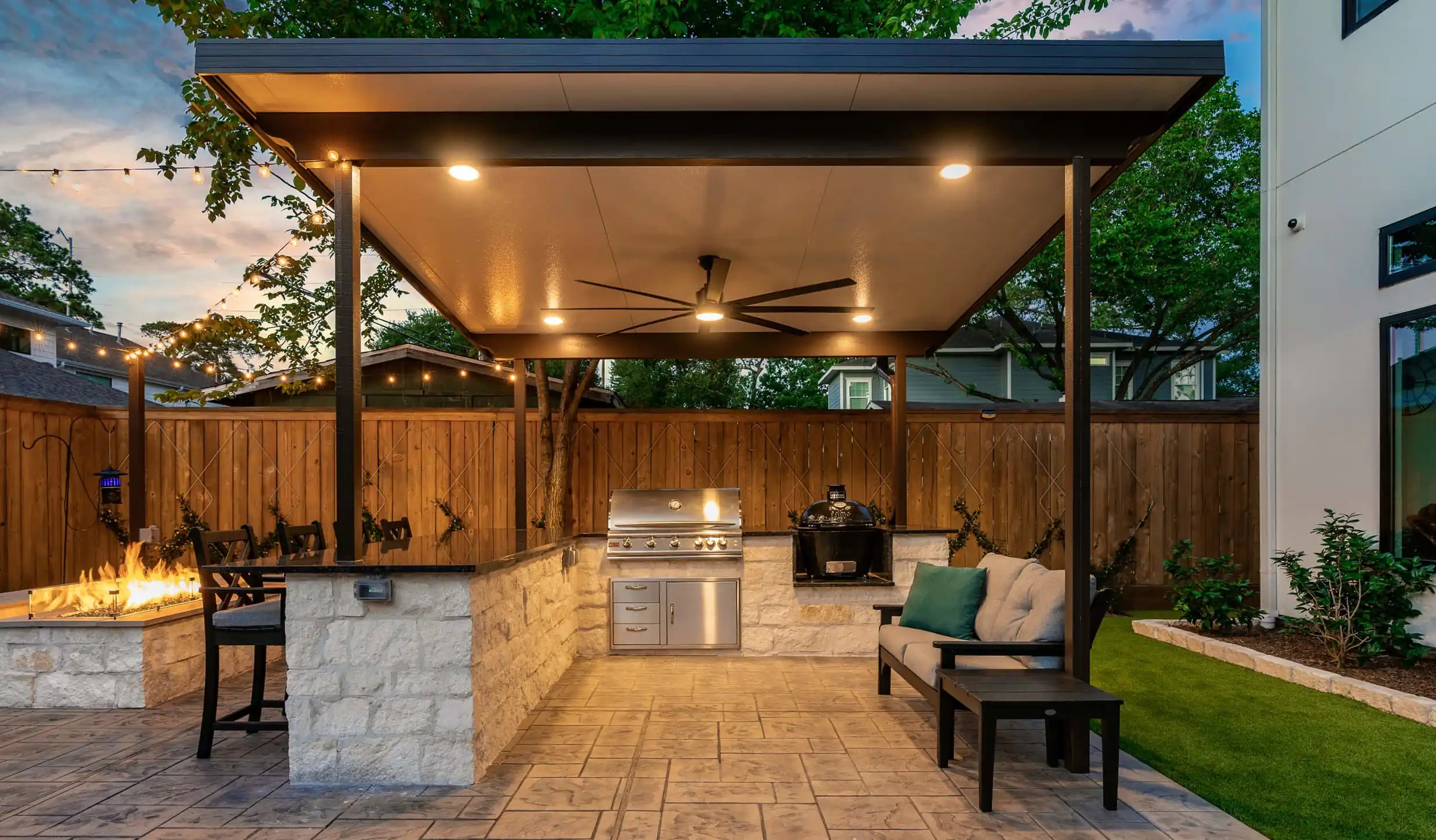 outdoor kitchen patio with shade structure and bar island