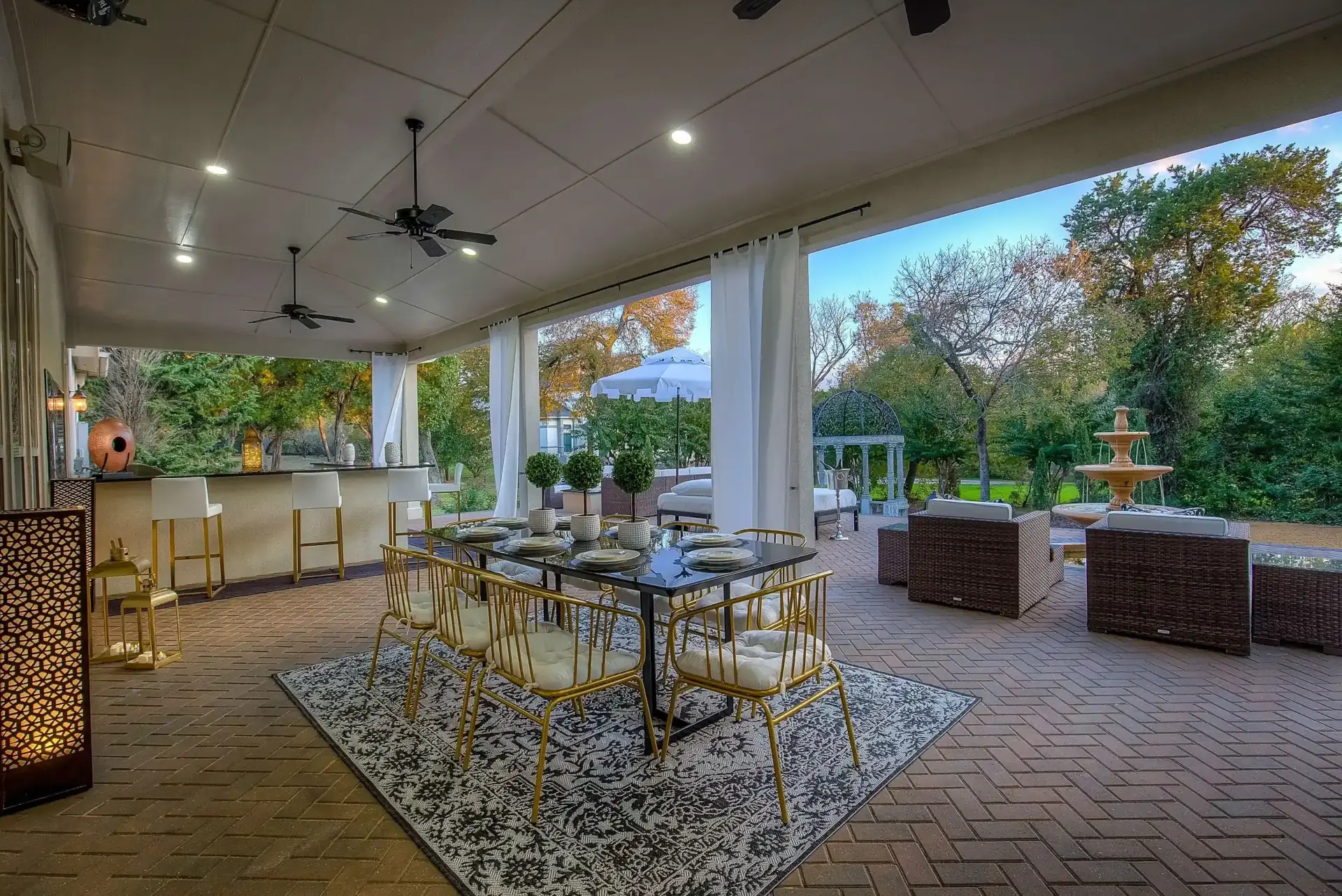 sleek modern outdoor living area and dining room under covered patio extension