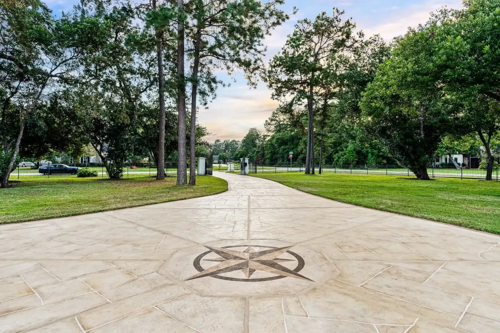 carvestone concrete overlay driveway, custom design with compass, texas