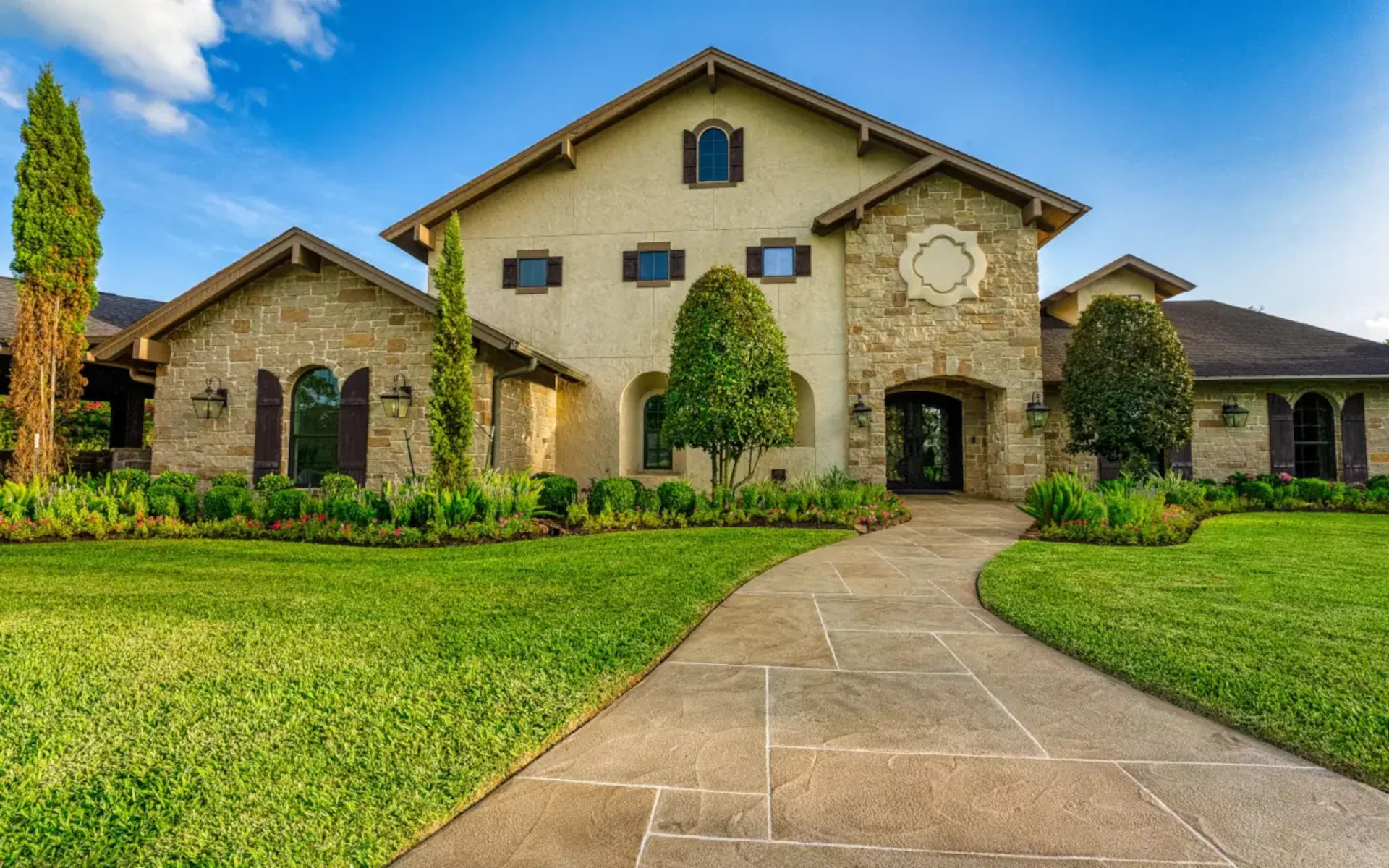 grand paver walkway in front yard from curb to front door, texas home