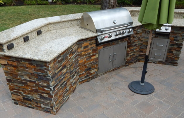 stacked stone custom outdoor grill island