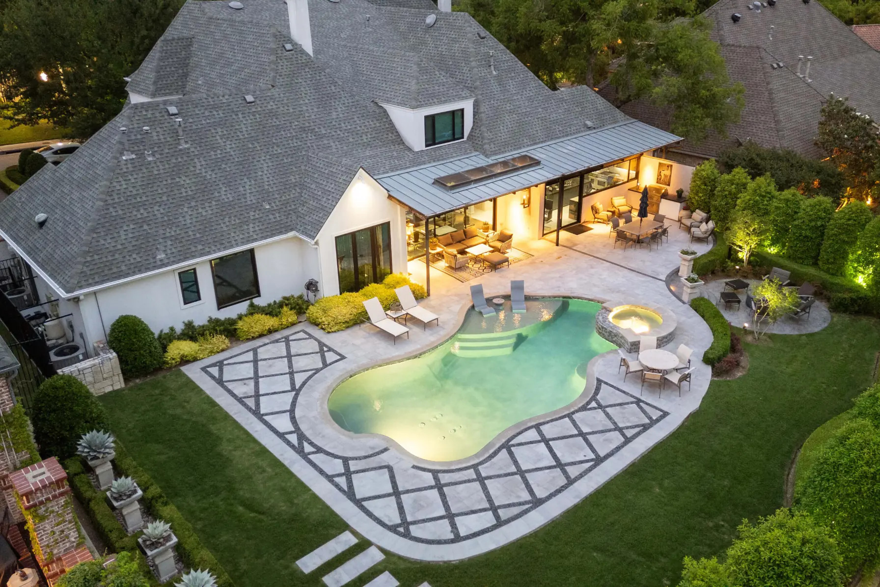 custom hardscape design in texas outdoor pool deck and patio space, allied outdoor solutions