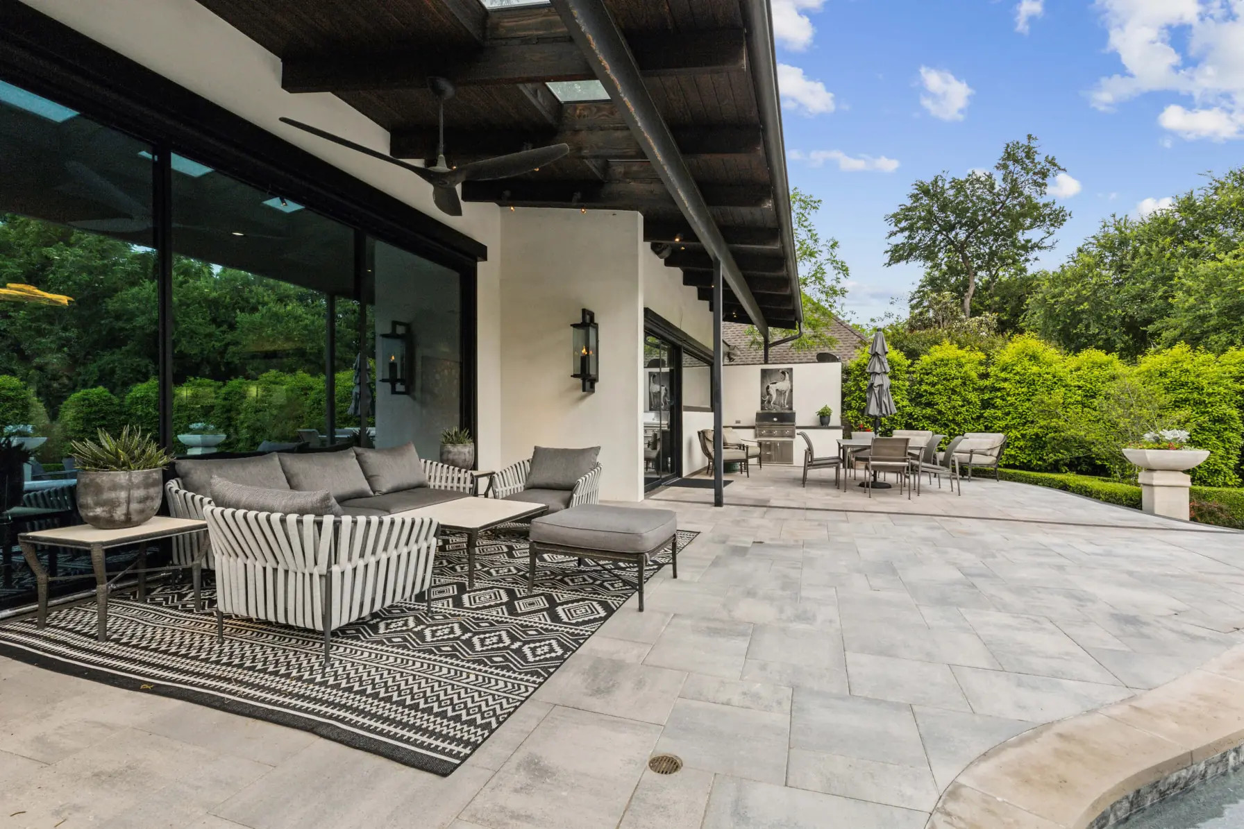 modern paver patio design with white and black palette, allied outdoor solutions