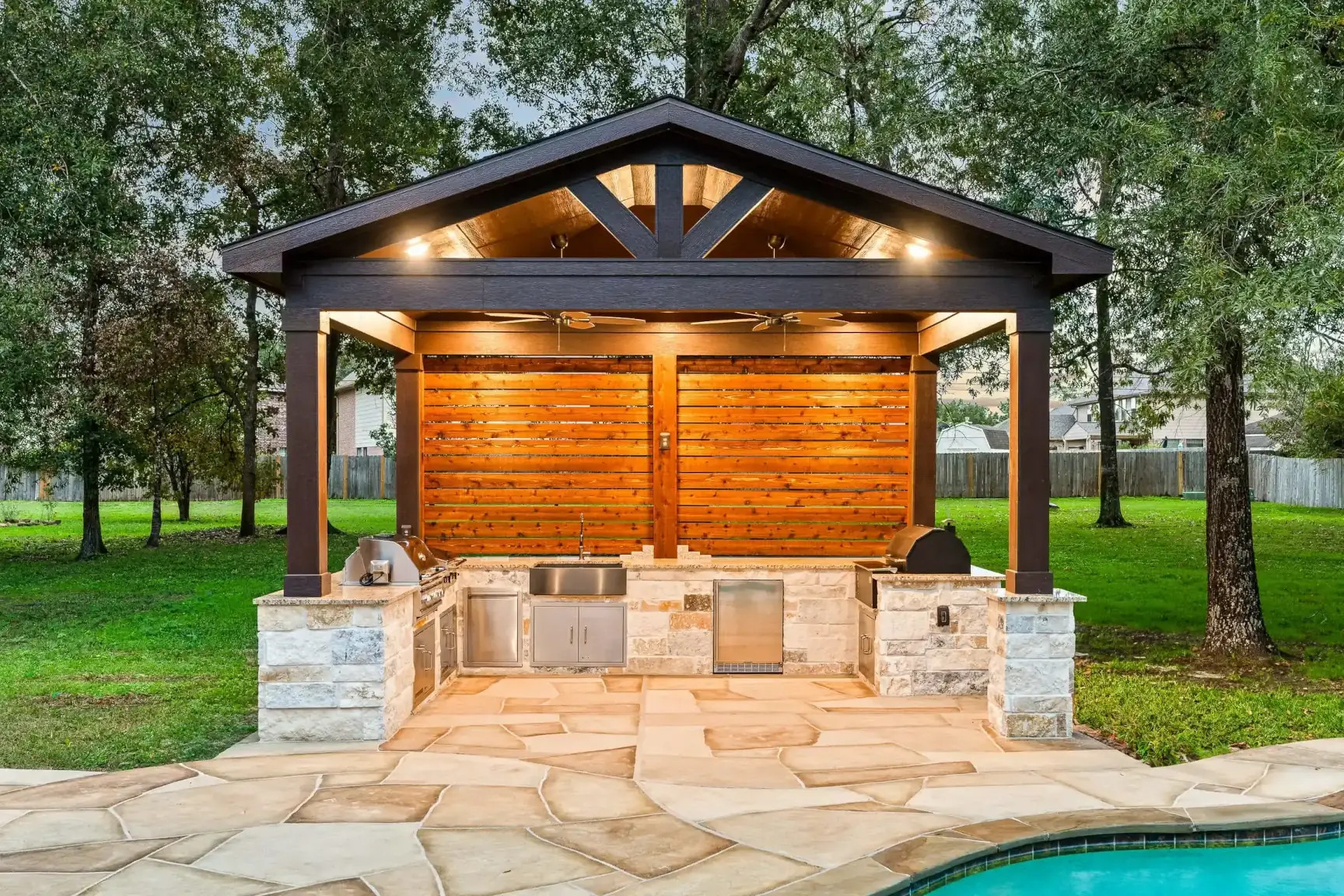 poolside cabana with solid gable roof structure in texas pool deck area