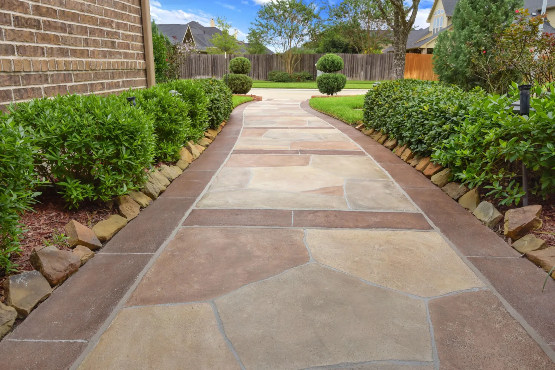 decorative carvestone concrete overlay in texas pathway design