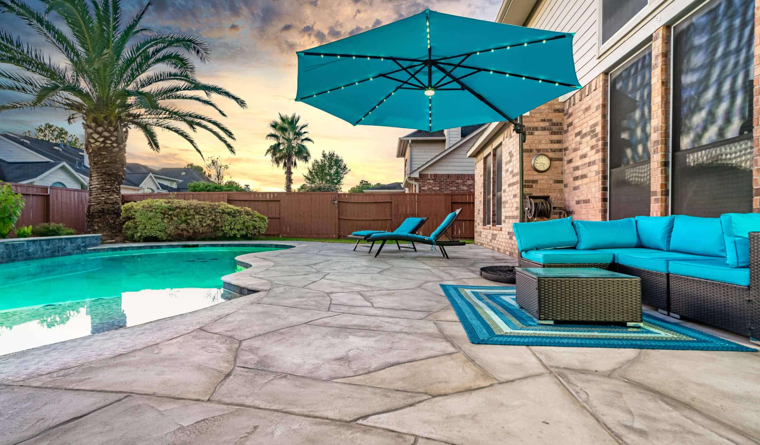 Grey custom pool deck for a Houston family