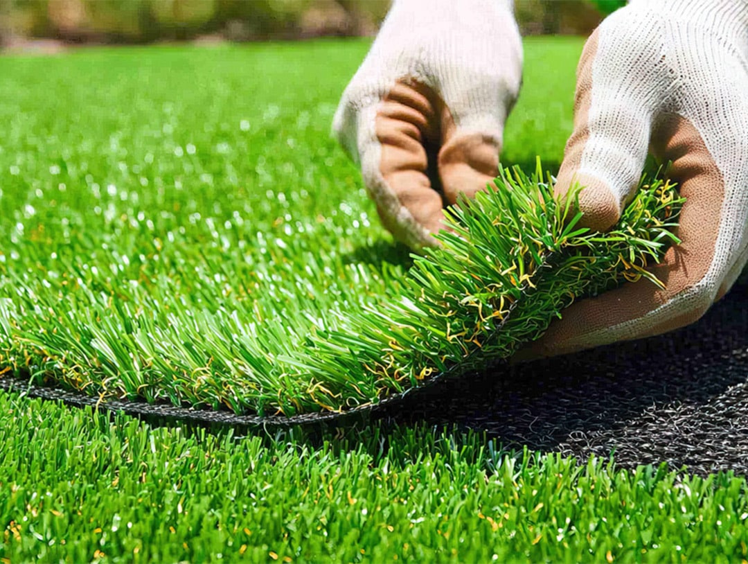 Artificial turf infill and finishing process for a durable lawn surface